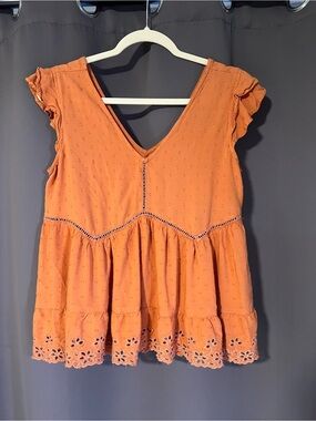 Sleeveless coral Eyelet V-Neck Peplum Tunic